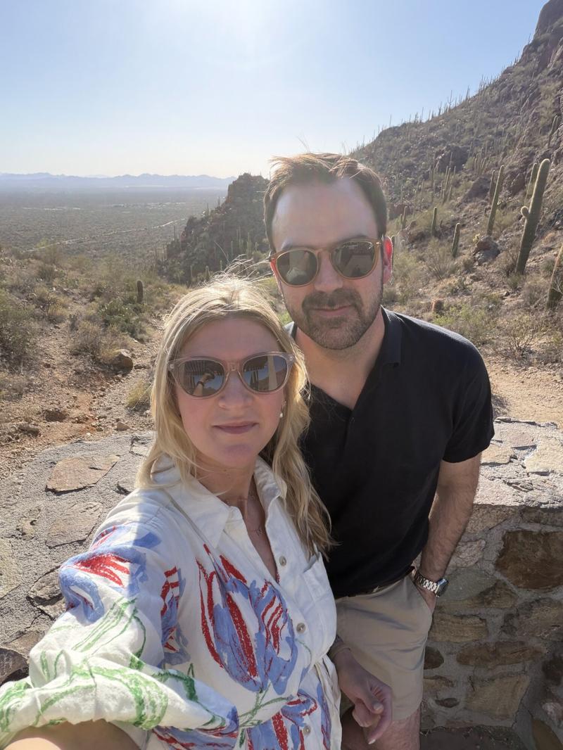 Greg and Natasha on a sunny desert overlook